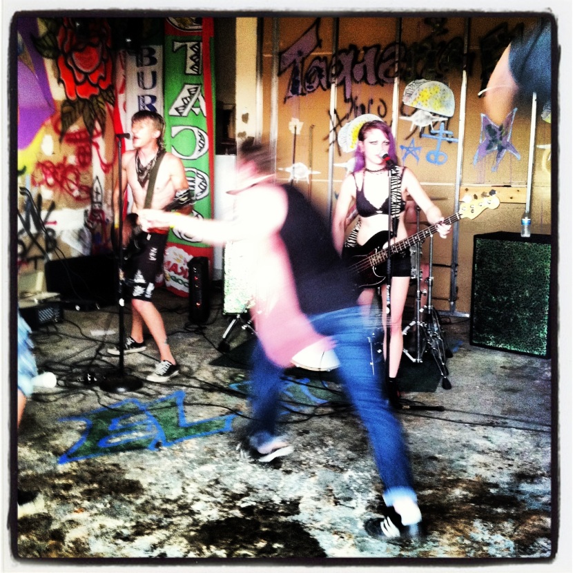 The Commonwealth of  American Natives, a Nashville punk three-piece, made room for a serious mosher during the band's set at Taco Fest 2K13 on May 18, 2013. Photo by Lucinda Breeding. 